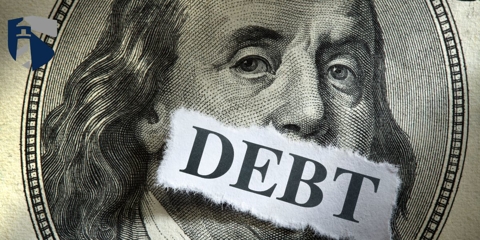 dollar with debt over the mouth